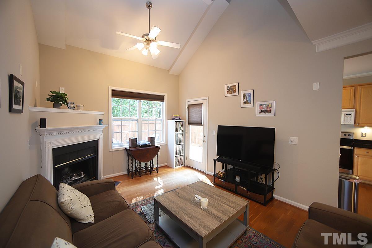 2656 Andover Glen Road Raleigh, NC 27604 - Photo 3 of 18 a living room with furniture and a flat screen tv