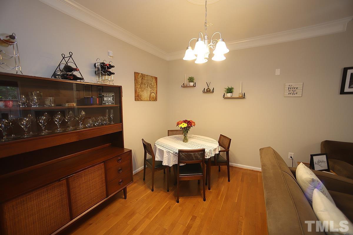2656 Andover Glen Road Raleigh, NC 27604 - Photo 8 of 18 a view of a dining room with furniture and chandelier