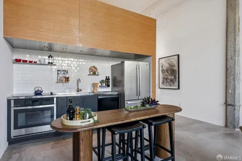 a kitchen with a table and chairs in it