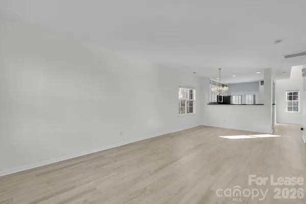a view of a kitchen with a sink and cabinets