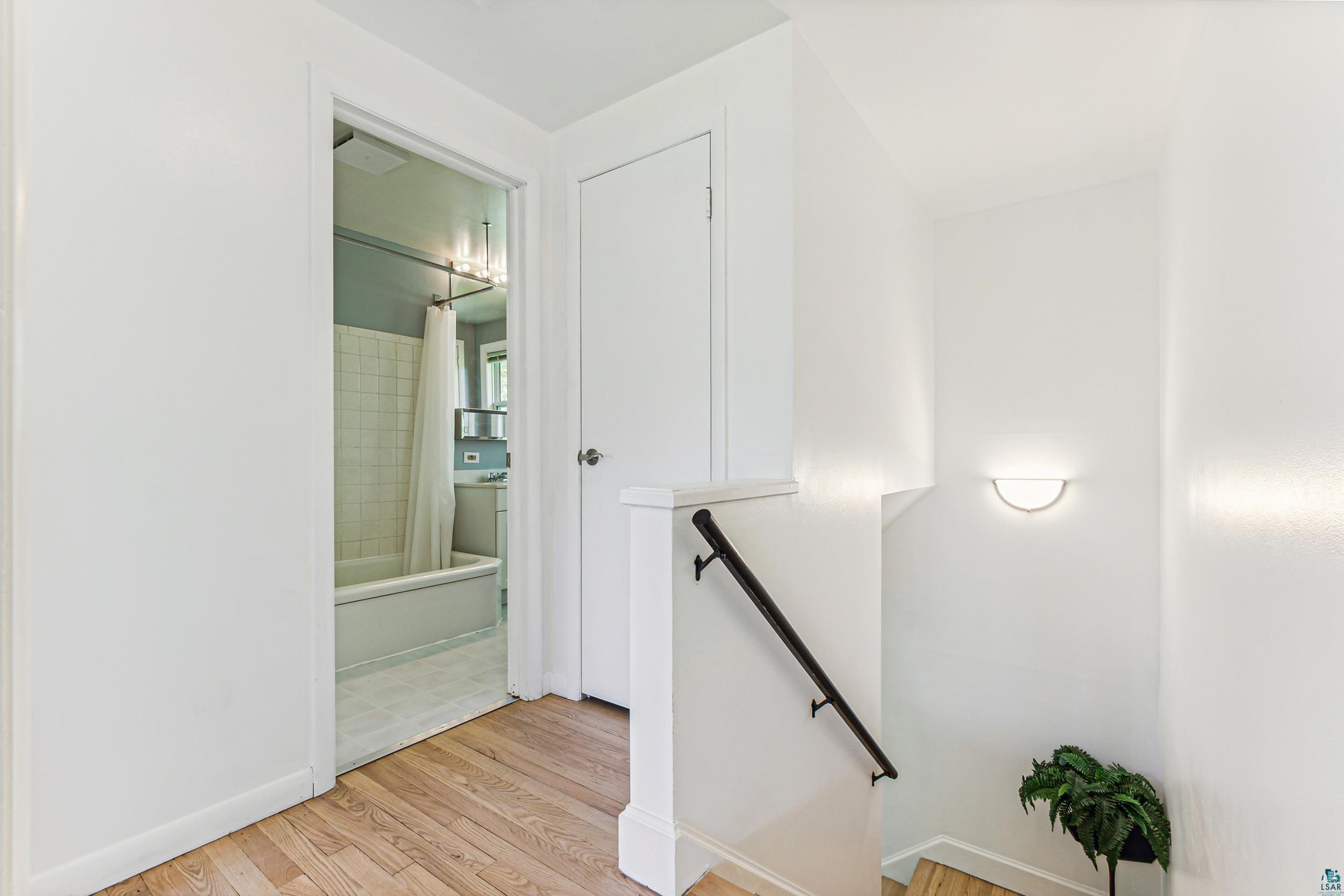 221 Mitchell Circle, Unit 52B Duluth, MN 55811 - Photo 19 of 27 Corridor with light wood-type flooring