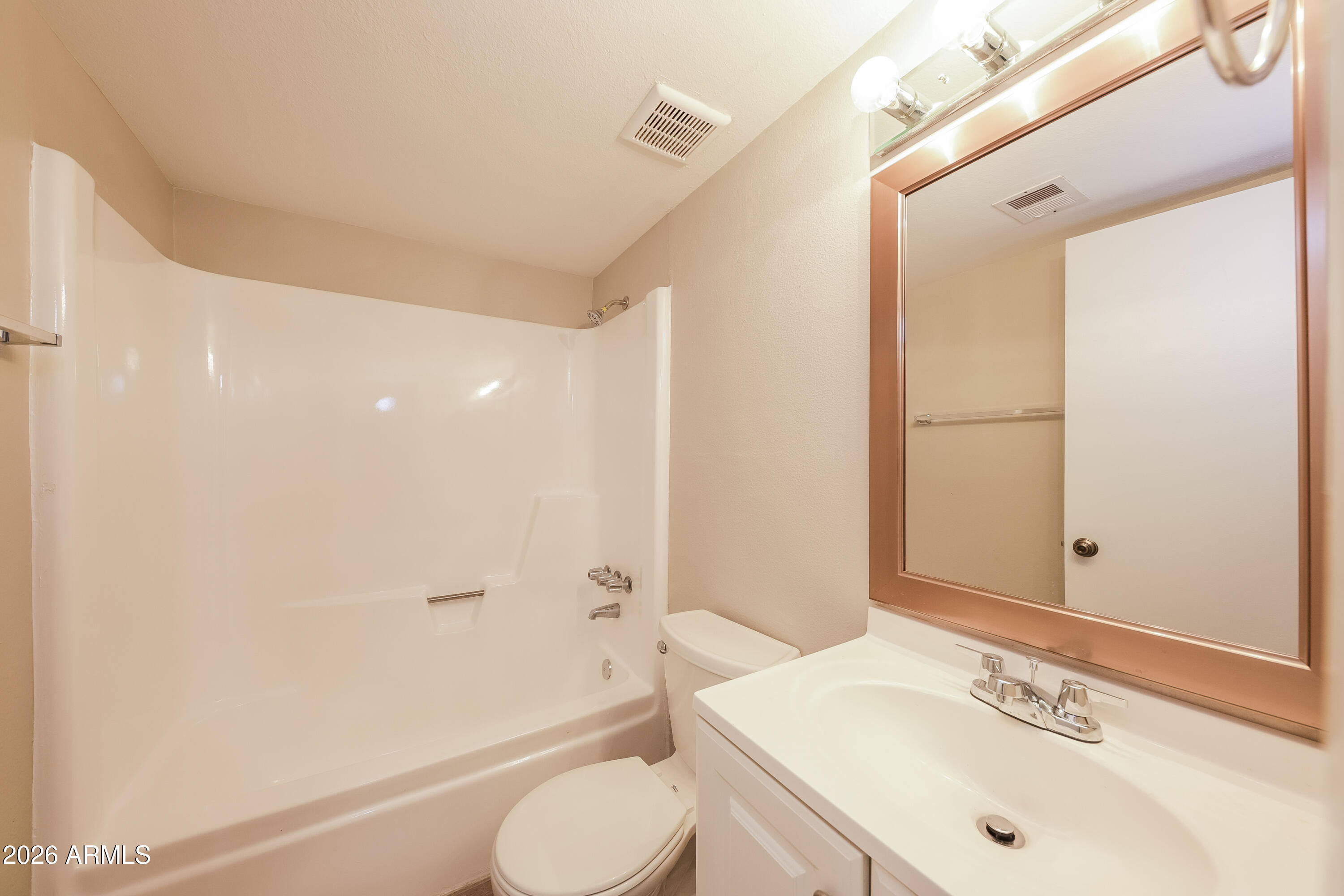 2501 East Villa Rita Drive Phoenix, AZ 85032 - Photo 5 of 15 a bathroom with a sink a toilet and shower