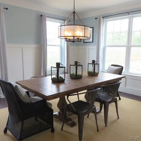 a dining room with furniture and window