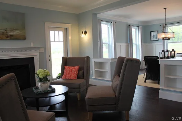 a view of a dining room with furniture window and wooden floor