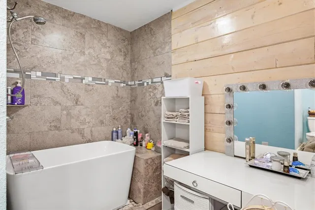 a bathroom with a bathtub and sink