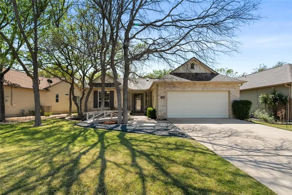 a front view of a house with swimming pool and porch with furniture