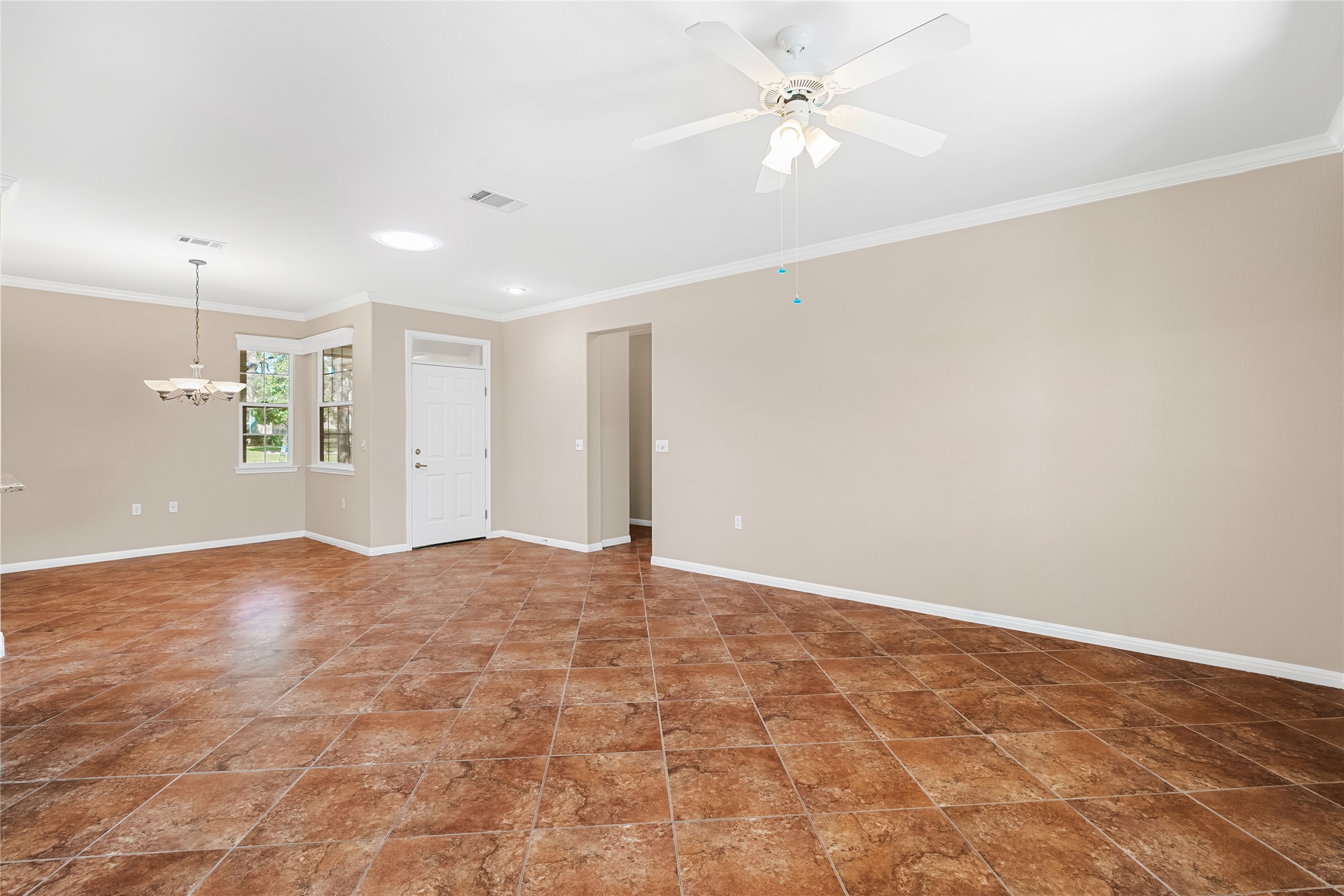 103 Harness Lane Georgetown, TX 78633 - Photo 11 of 38 an empty room with an entryway and fan