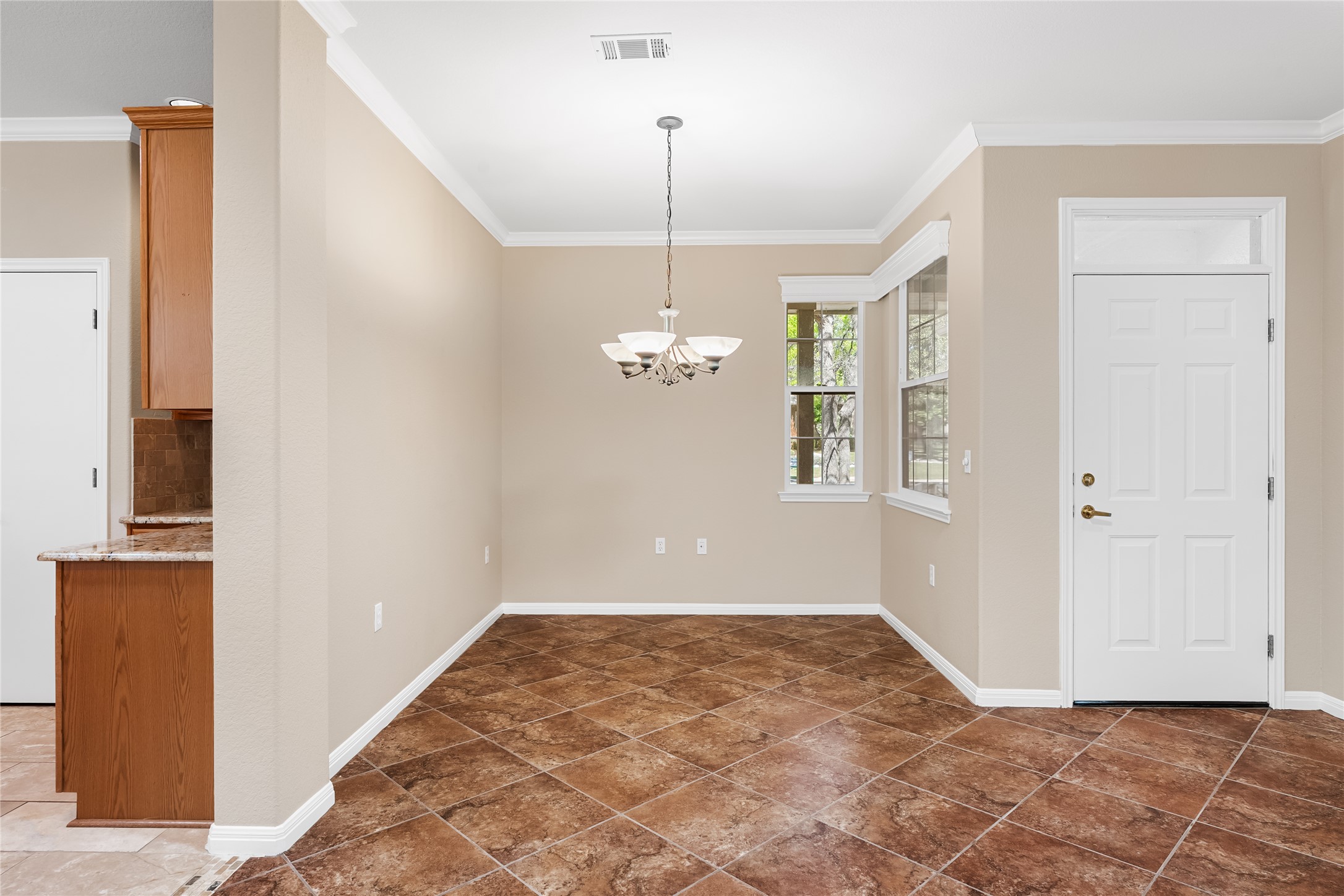 103 Harness Lane Georgetown, TX 78633 - Photo 12 of 38 a view of an empty room with window and cabinet