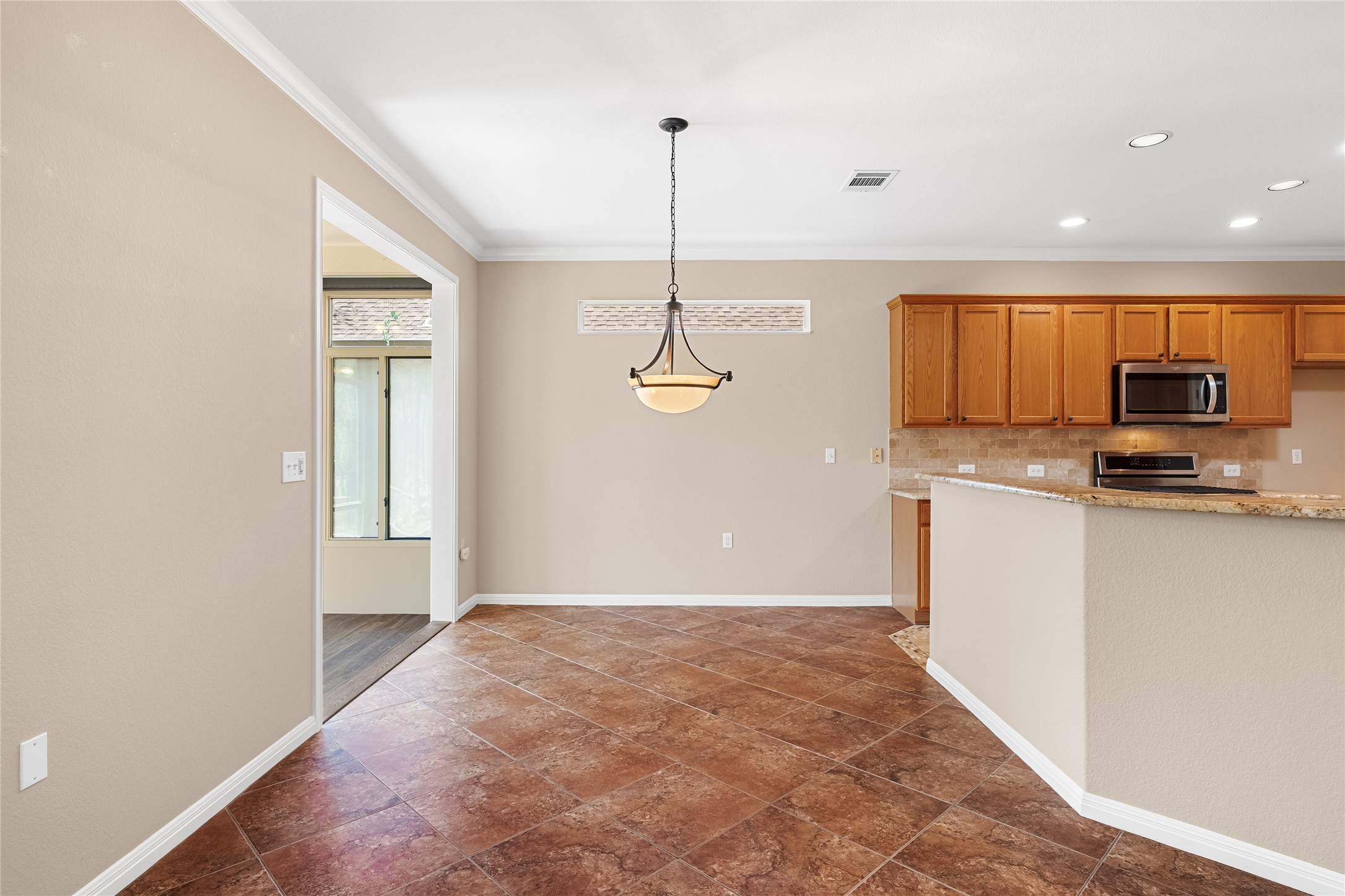 103 Harness Lane Georgetown, TX 78633 - Photo 13 of 38 a view of a kitchen with microwave and cabinets