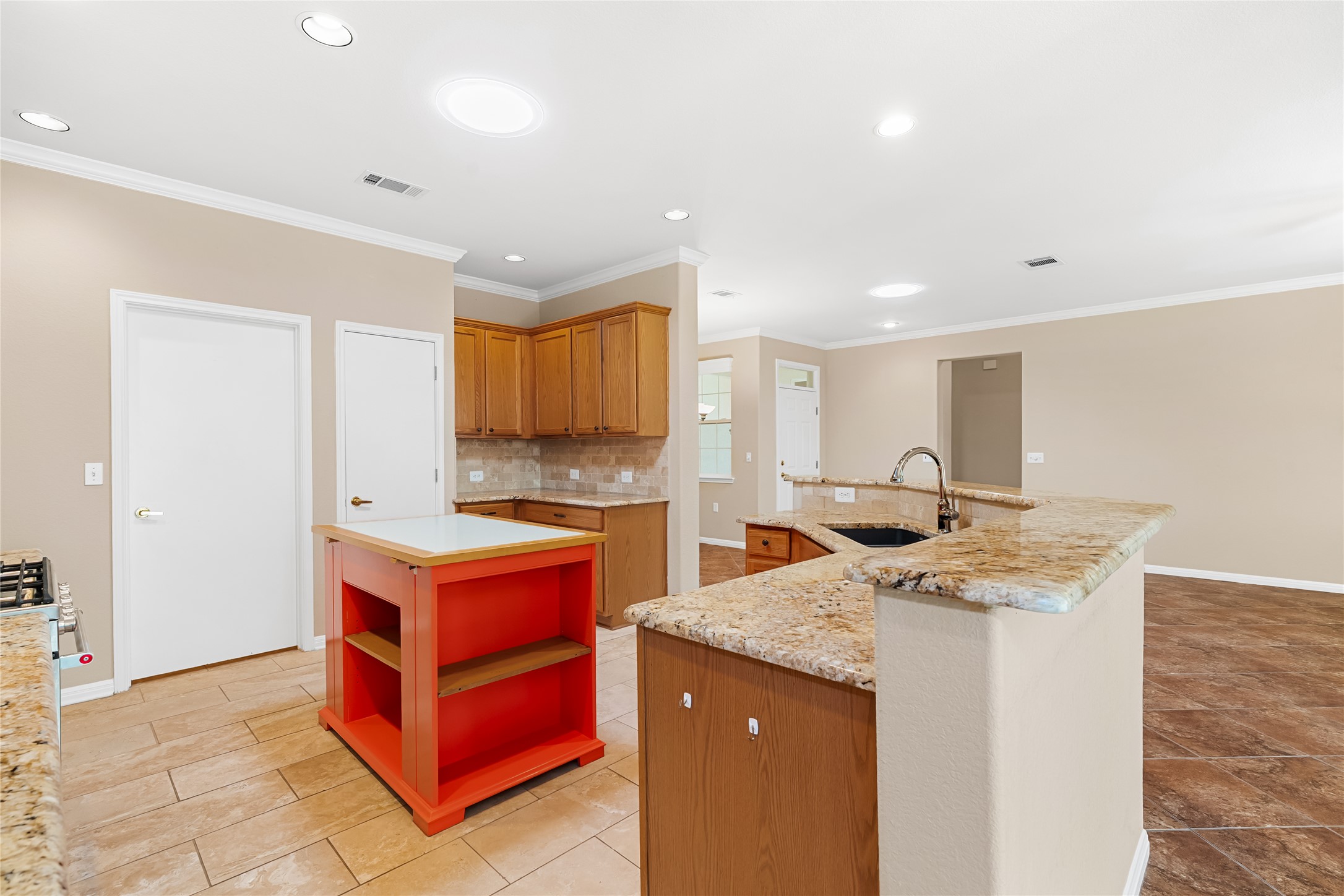 103 Harness Lane Georgetown, TX 78633 - Photo 14 of 38 a kitchen that has a lot of cabinets in it