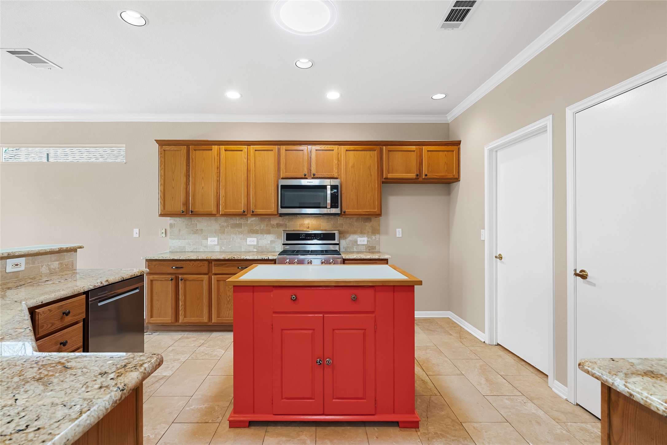 103 Harness Lane Georgetown, TX 78633 - Photo 15 of 38 a kitchen with stainless steel appliances granite countertop a stove top oven a sink dishwasher a refrigerator and cabinets with wooden floor