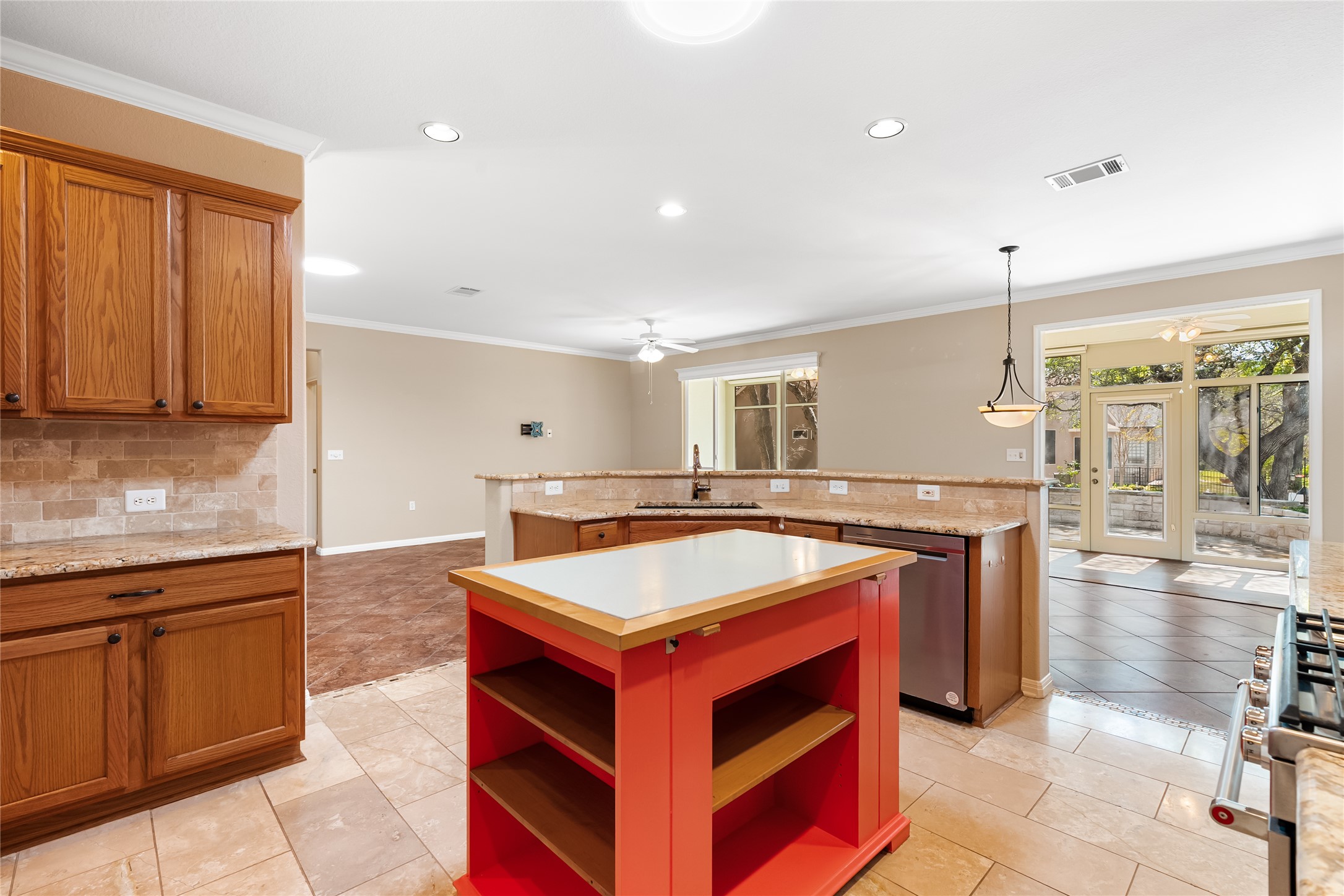 103 Harness Lane Georgetown, TX 78633 - Photo 16 of 38 a kitchen with stainless steel appliances granite countertop a stove a sink and a refrigerator