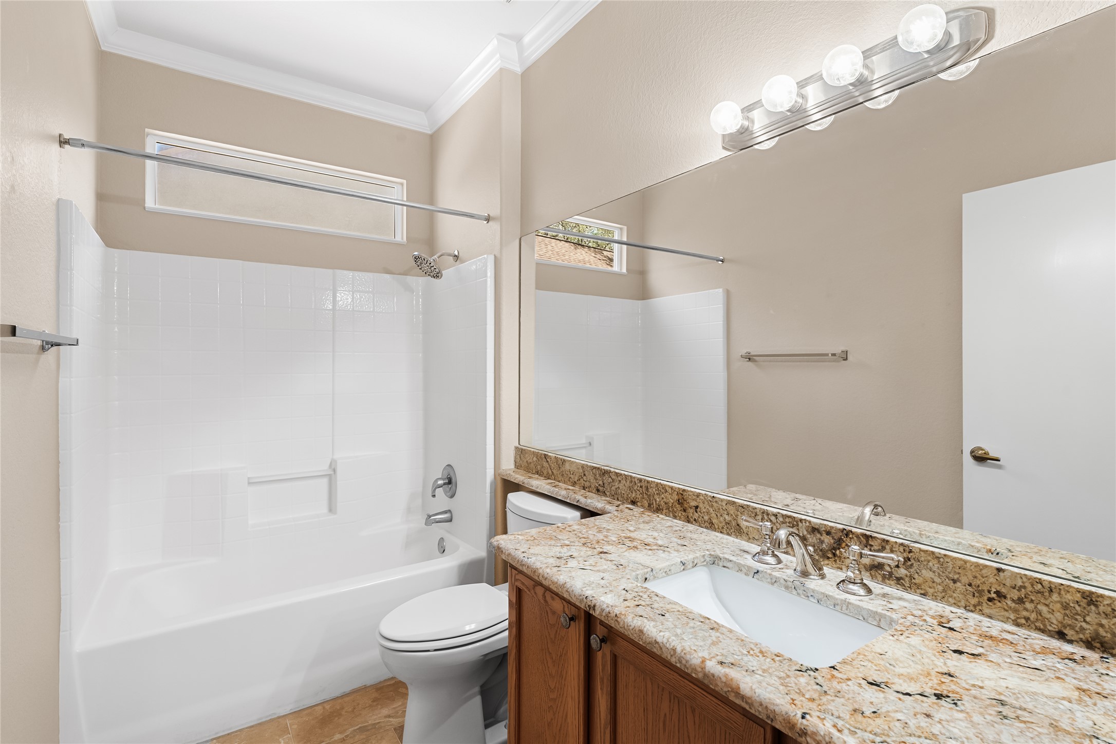 103 Harness Lane Georgetown, TX 78633 - Photo 25 of 38 a bathroom with a granite countertop sink toilet and shower