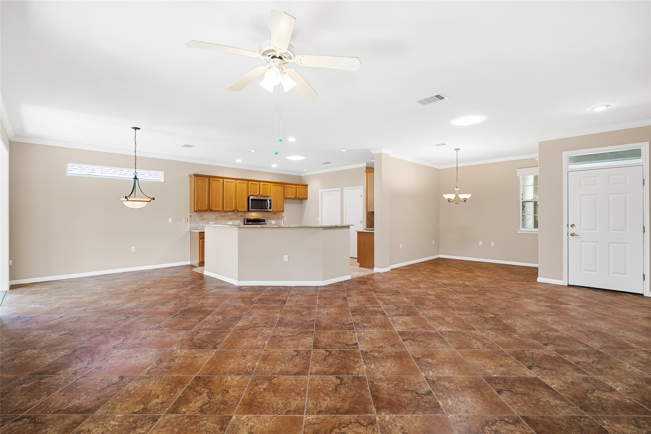 103 Harness Lane Georgetown, TX 78633 - Photo 10 of 38 a view of a kitchen with a sink and a refrigerator
