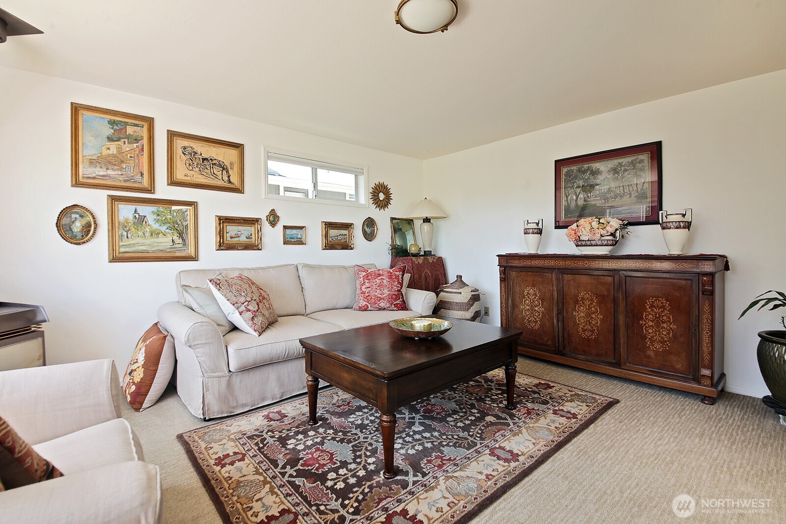 424 Island View Lane Langley, WA 98260 - Photo 16 of 39 a living room with furniture and paintings on the wall