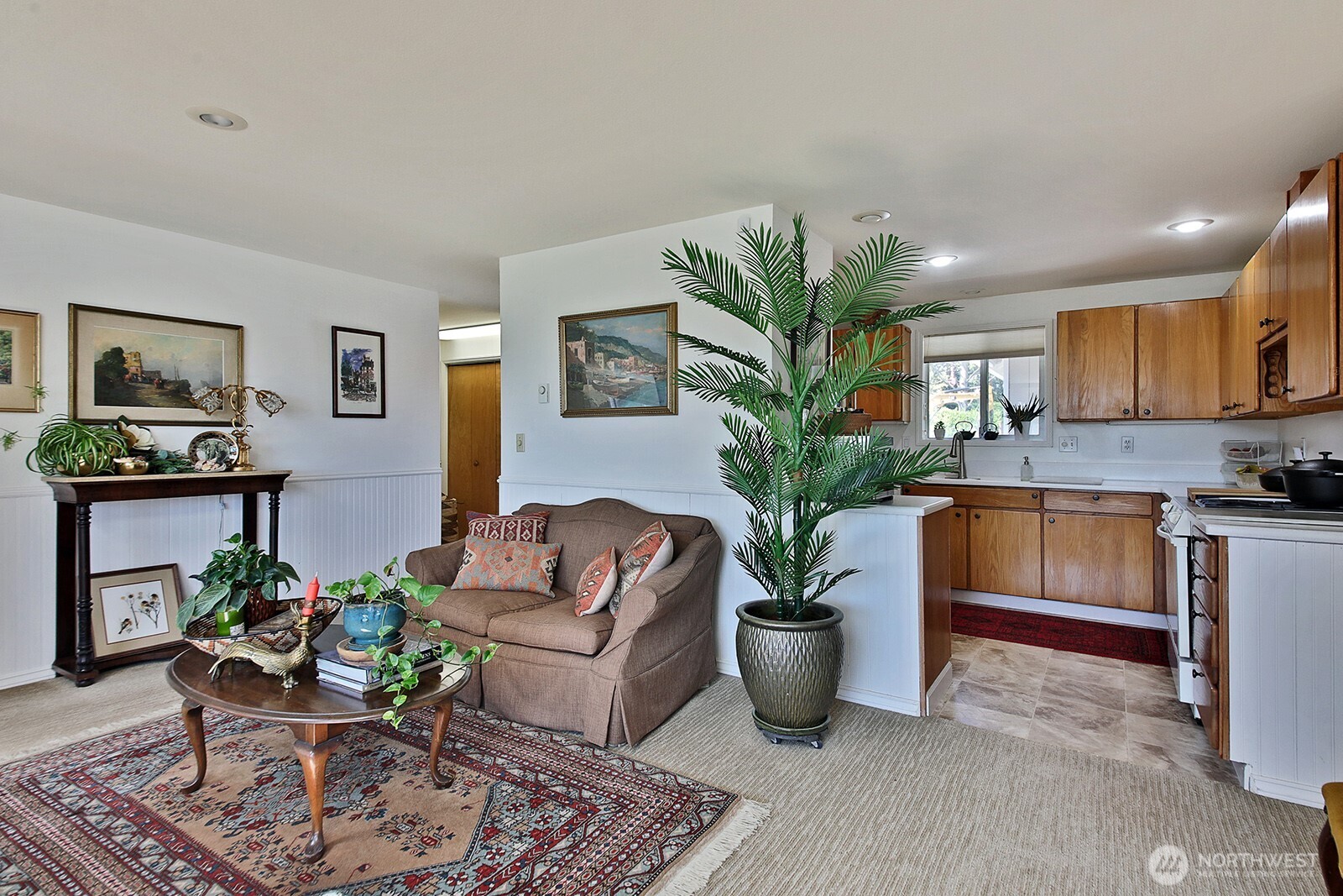 424 Island View Lane Langley, WA 98260 - Photo 17 of 39 a living room with furniture a potted plant and kitchen view