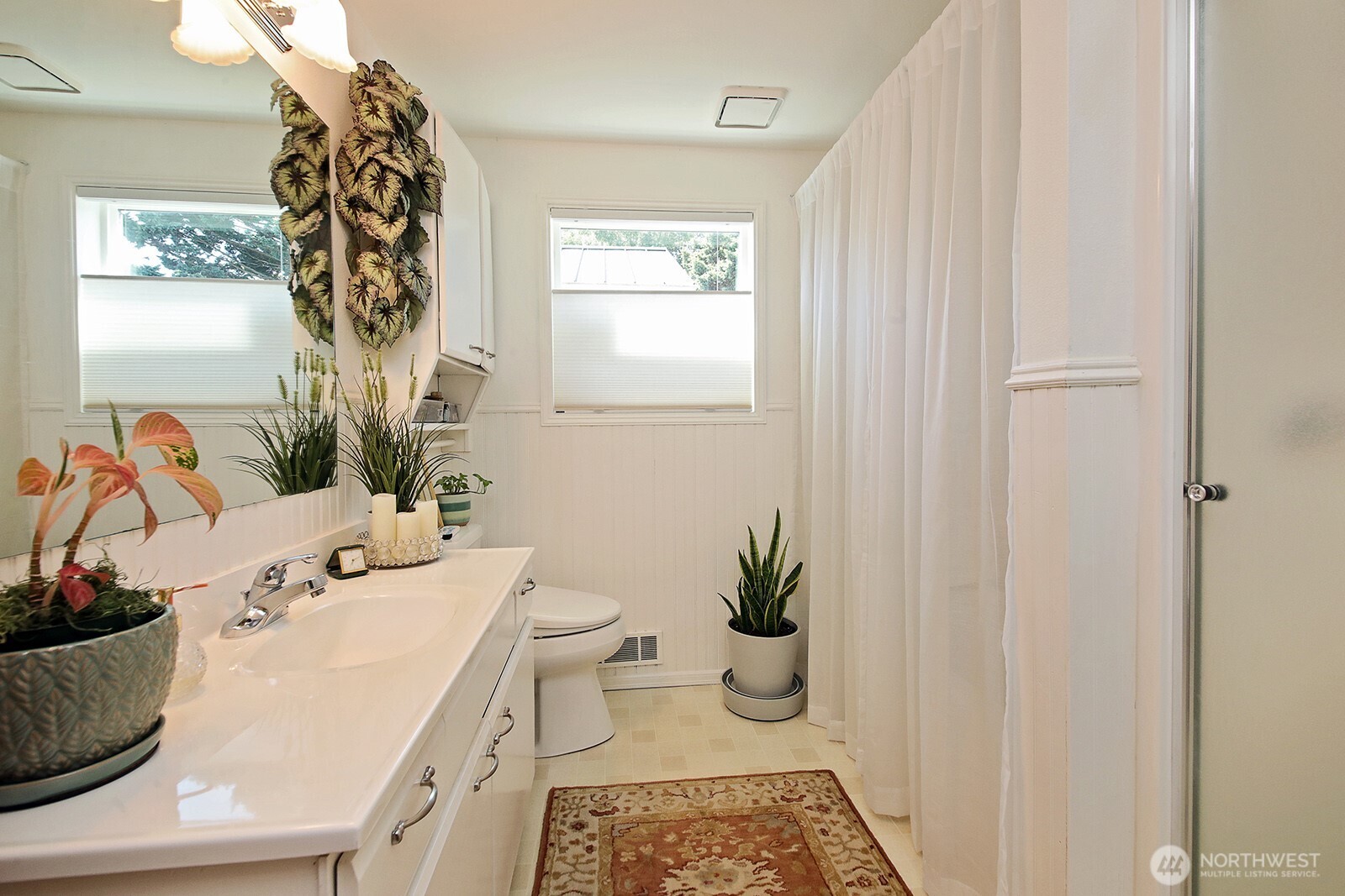 424 Island View Lane Langley, WA 98260 - Photo 23 of 39 a bathroom with a sink toilet and window