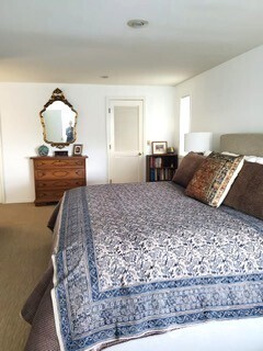 424 Island View Lane Langley, WA 98260 - Photo 25 of 39 a bedroom with a bed and a dresser
