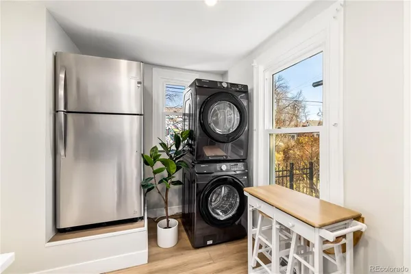 a view of a storage and utility room with washer and dryer