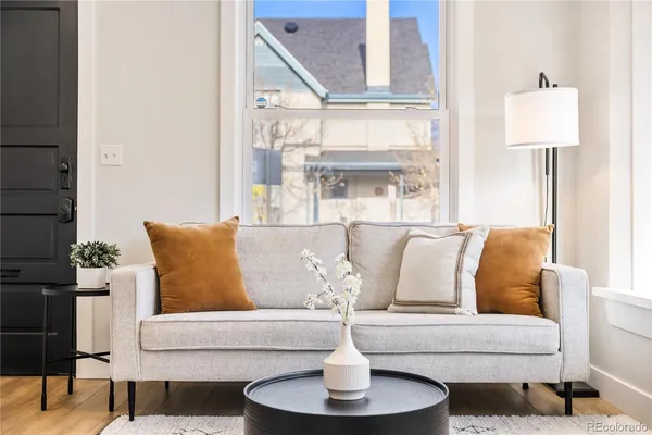 a living room with furniture and a large window