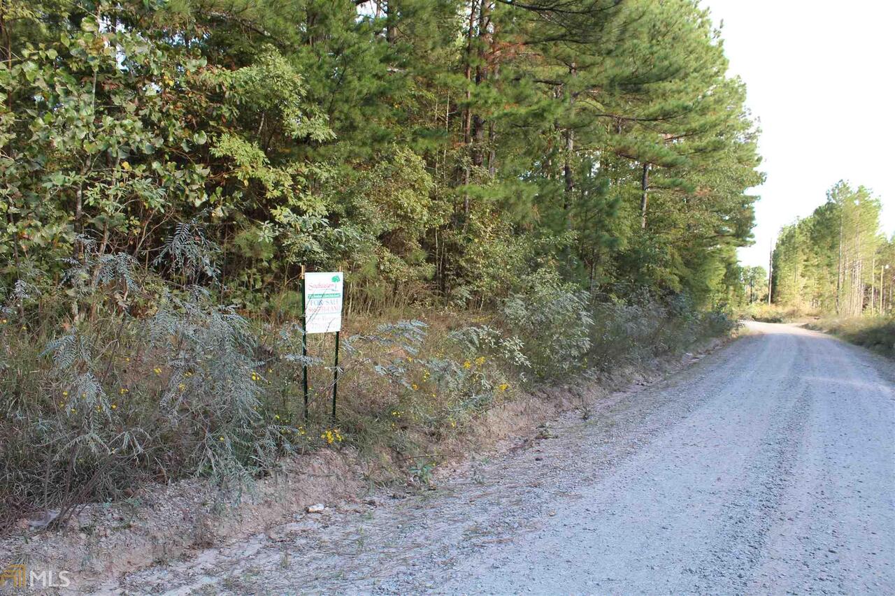 60 Faulkner Road Waco, GA 30182 - Photo 1 of 1 a view of a dry yard with trees