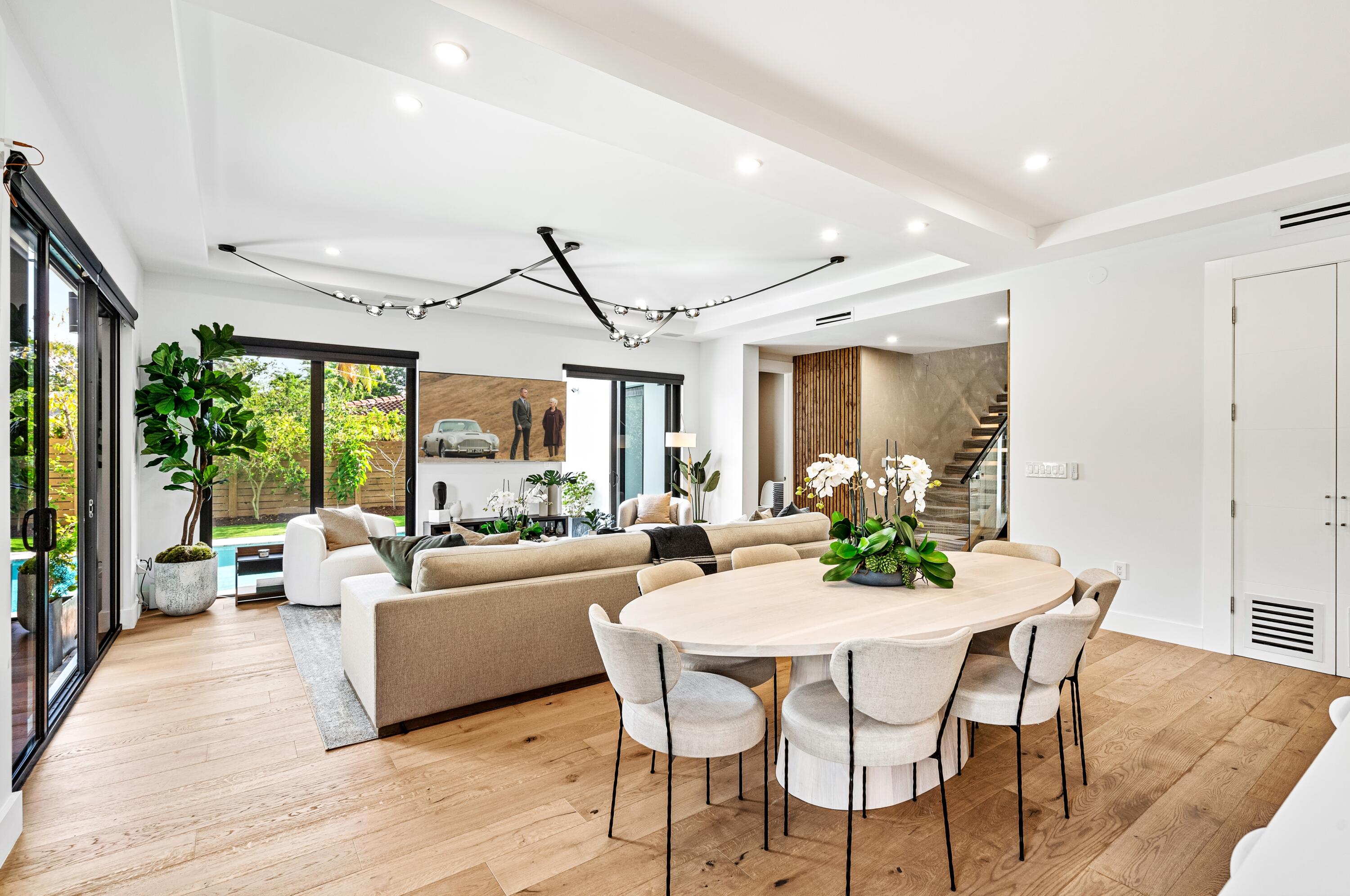 709 Northwest 6th Drive Boca Raton, FL 33486 - Photo 11 of 45 a view of a dining room with furniture window and wooden floor