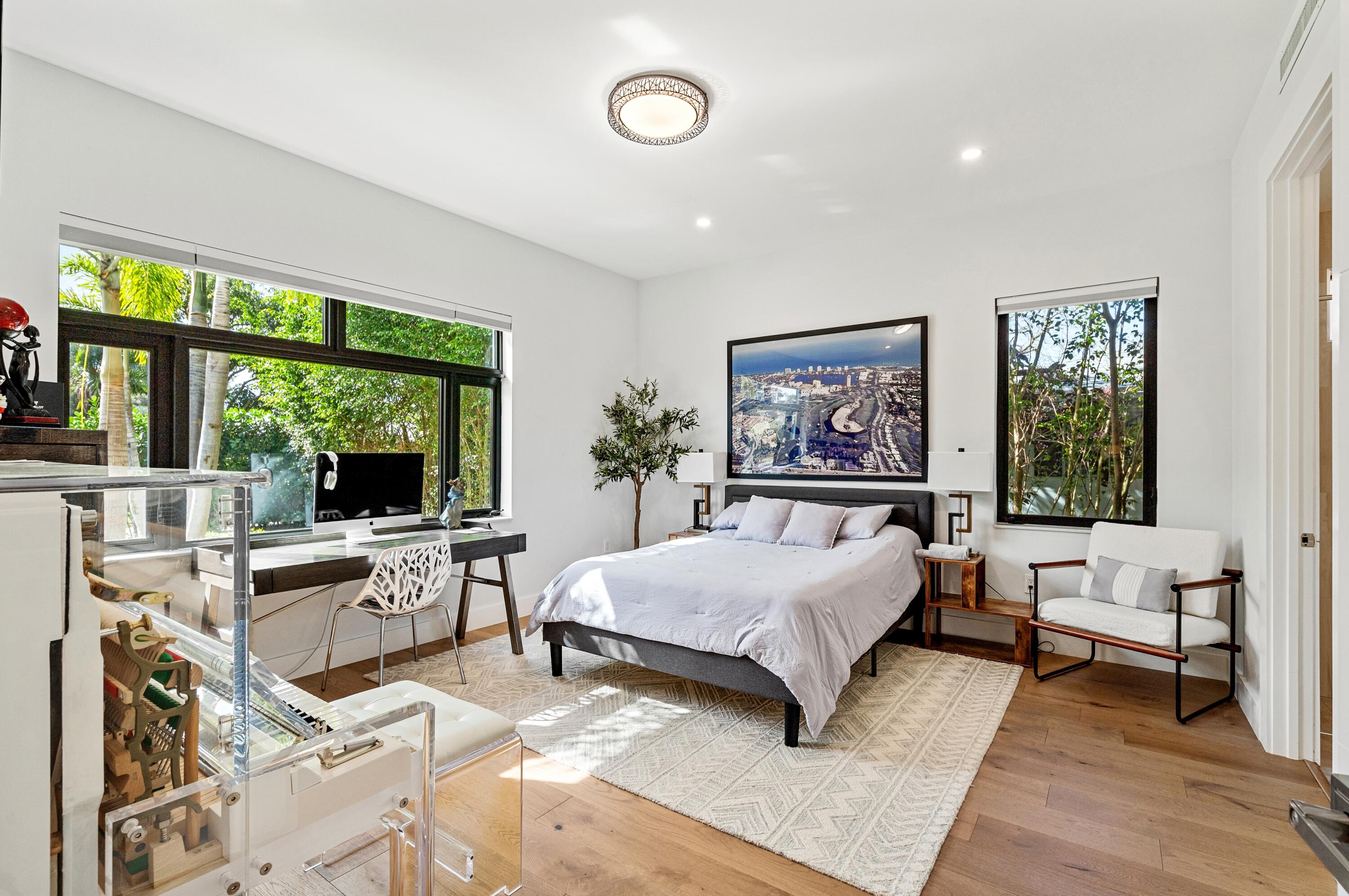 709 Northwest 6th Drive Boca Raton, FL 33486 - Photo 14 of 45 a bedroom with a large bed and a large window