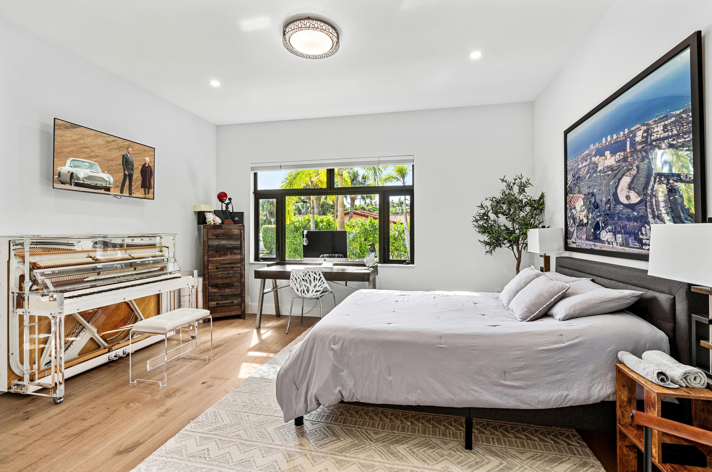 709 Northwest 6th Drive Boca Raton, FL 33486 - Photo 15 of 45 a bedroom with a bed and a large window