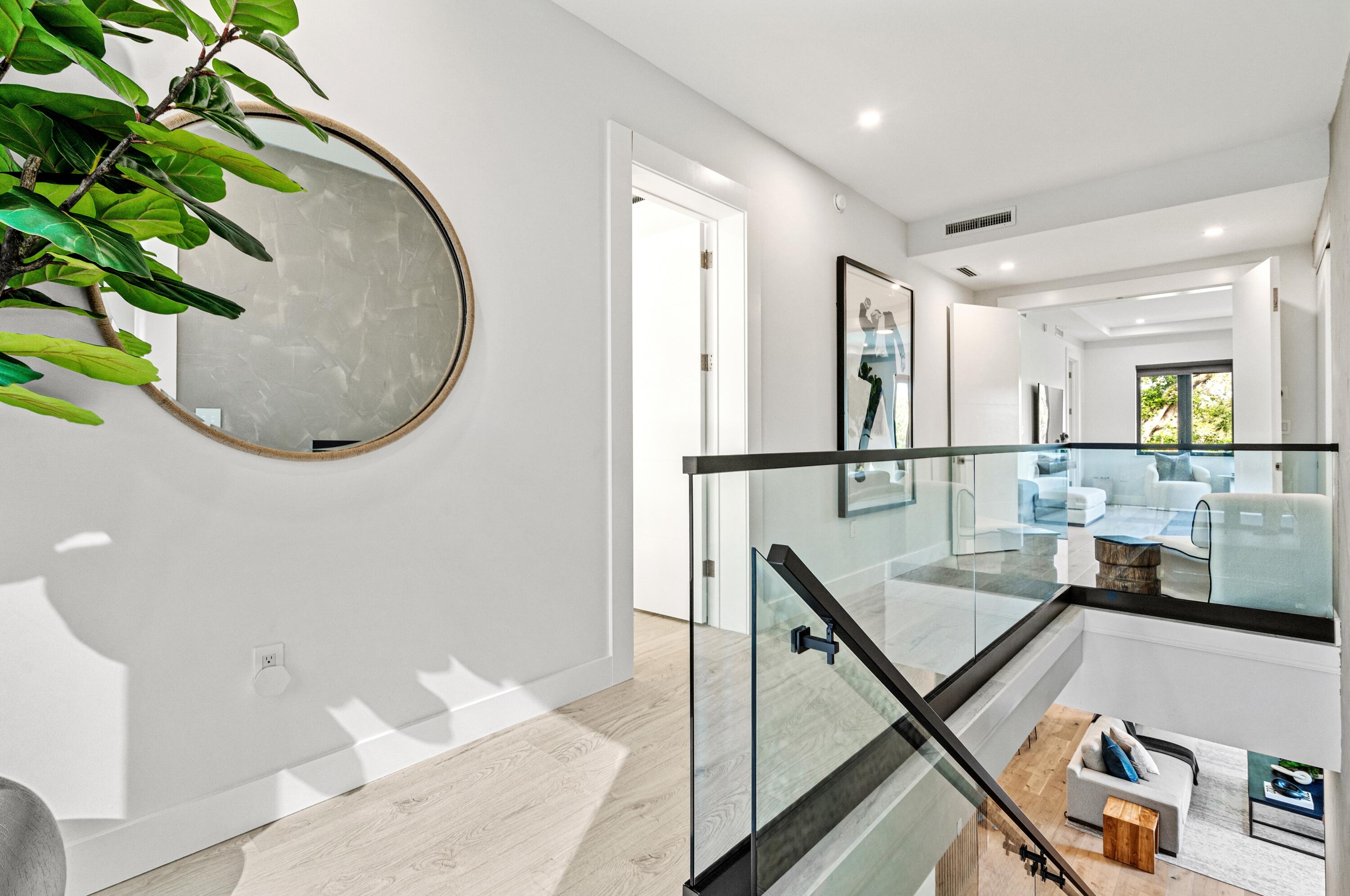 709 Northwest 6th Drive Boca Raton, FL 33486 - Photo 17 of 45 a picture of a room with wooden floor and potted plant