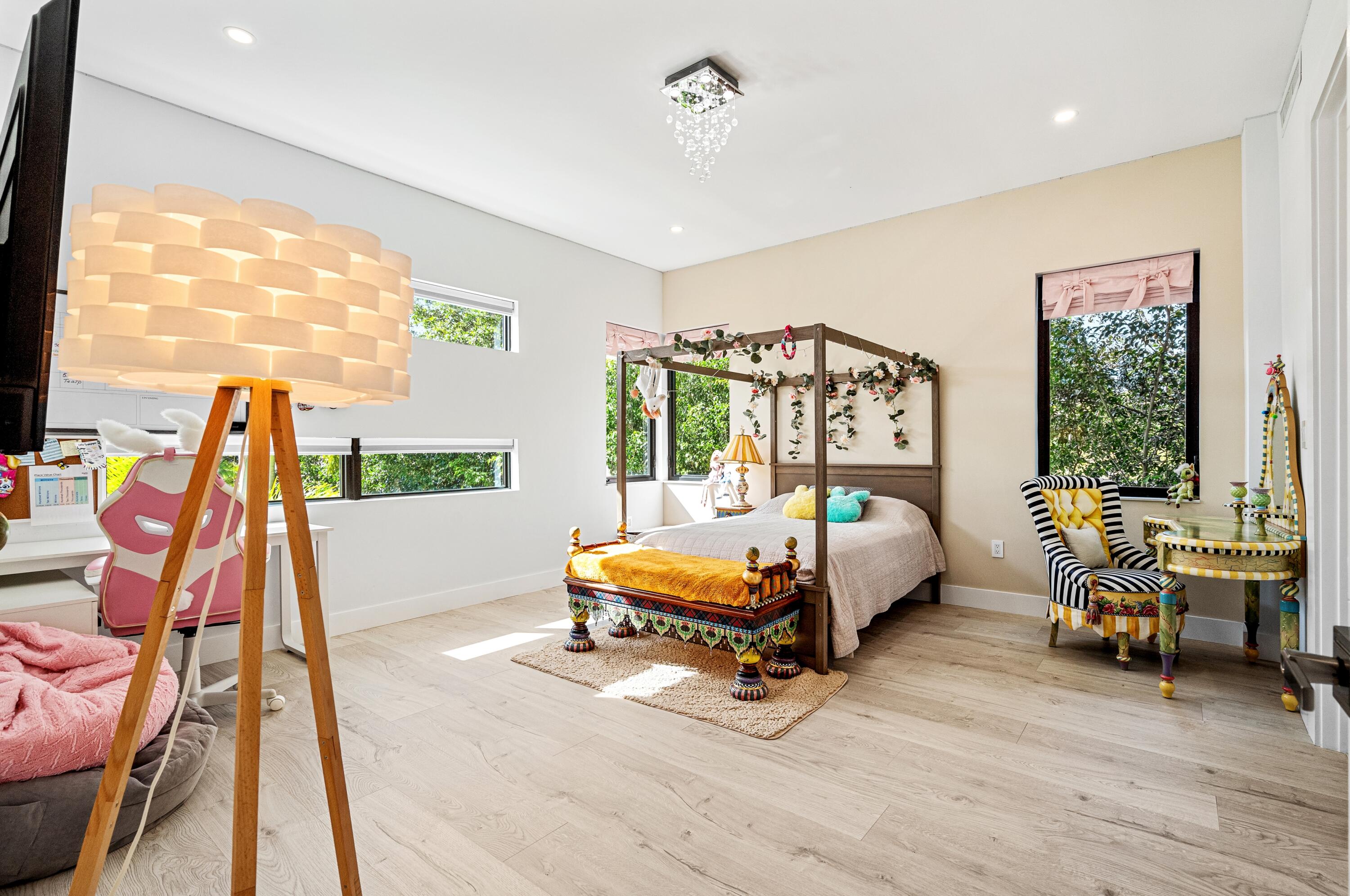 709 Northwest 6th Drive Boca Raton, FL 33486 - Photo 21 of 45 a bedroom with furniture and a large window