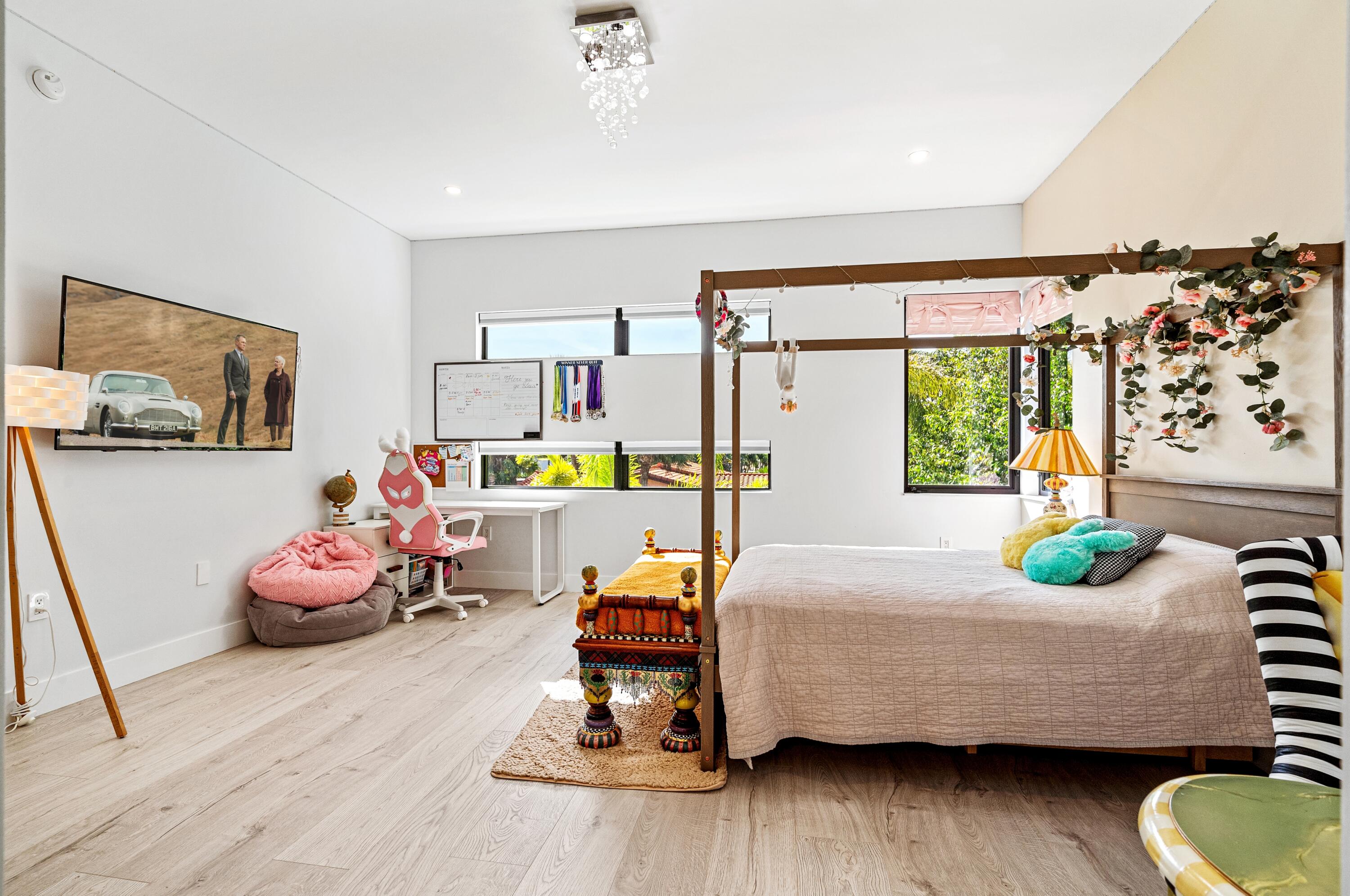 709 Northwest 6th Drive Boca Raton, FL 33486 - Photo 22 of 45 a bedroom with furniture and a wooden floor