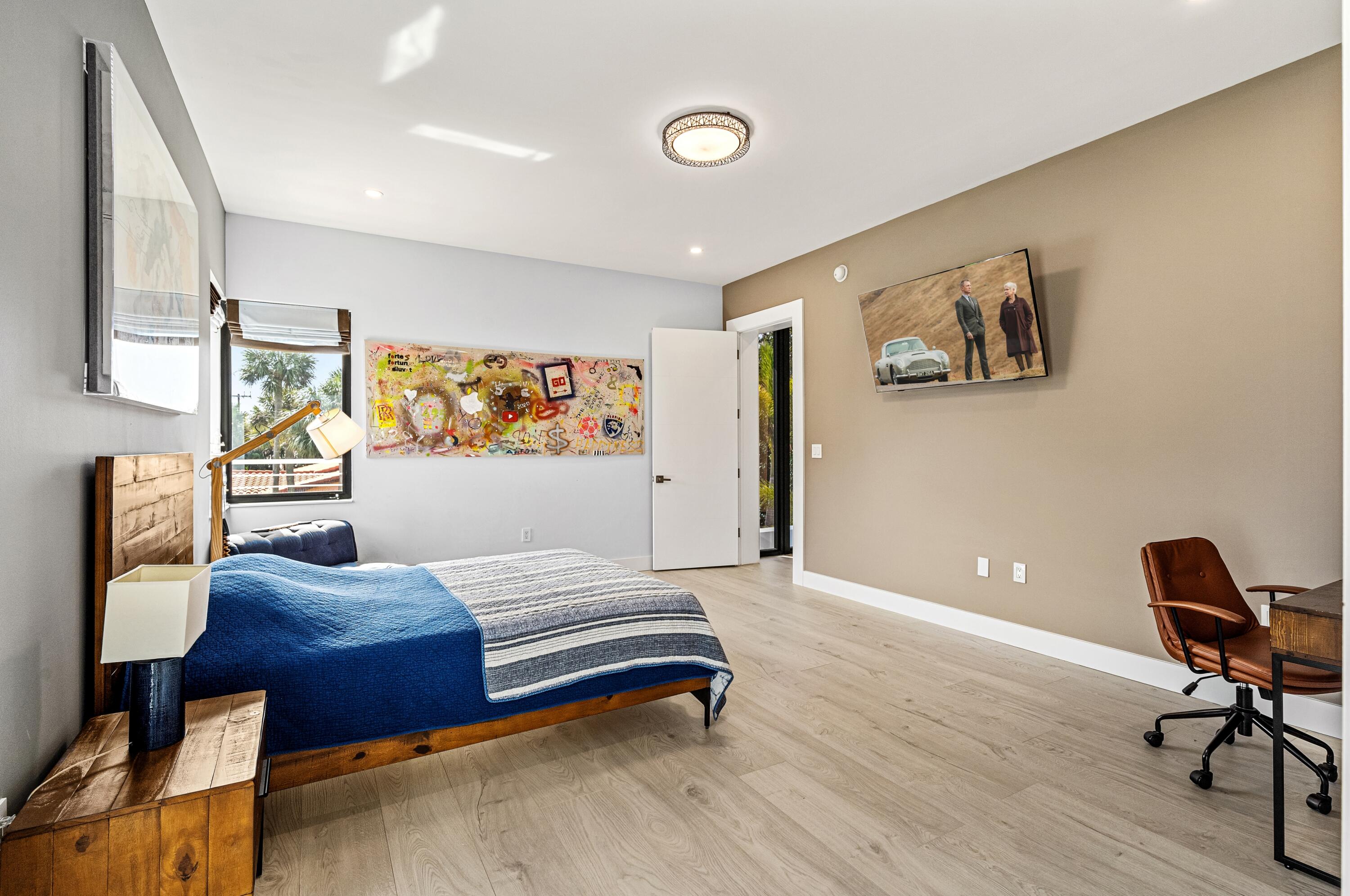 709 Northwest 6th Drive Boca Raton, FL 33486 - Photo 25 of 45 a bedroom with furniture and wooden floor