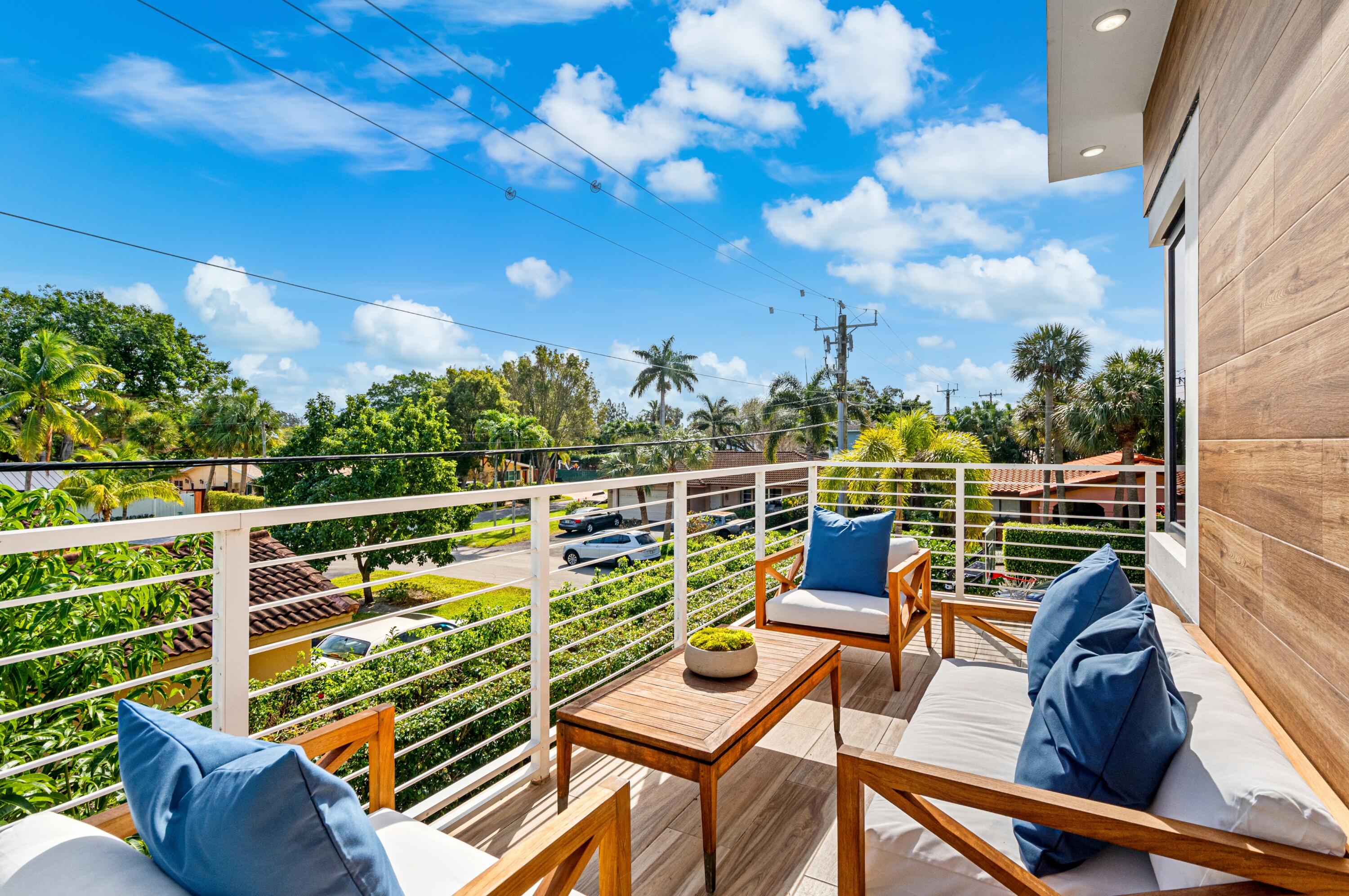 709 Northwest 6th Drive Boca Raton, FL 33486 - Photo 27 of 45 a view of a chairs and table in the balcony