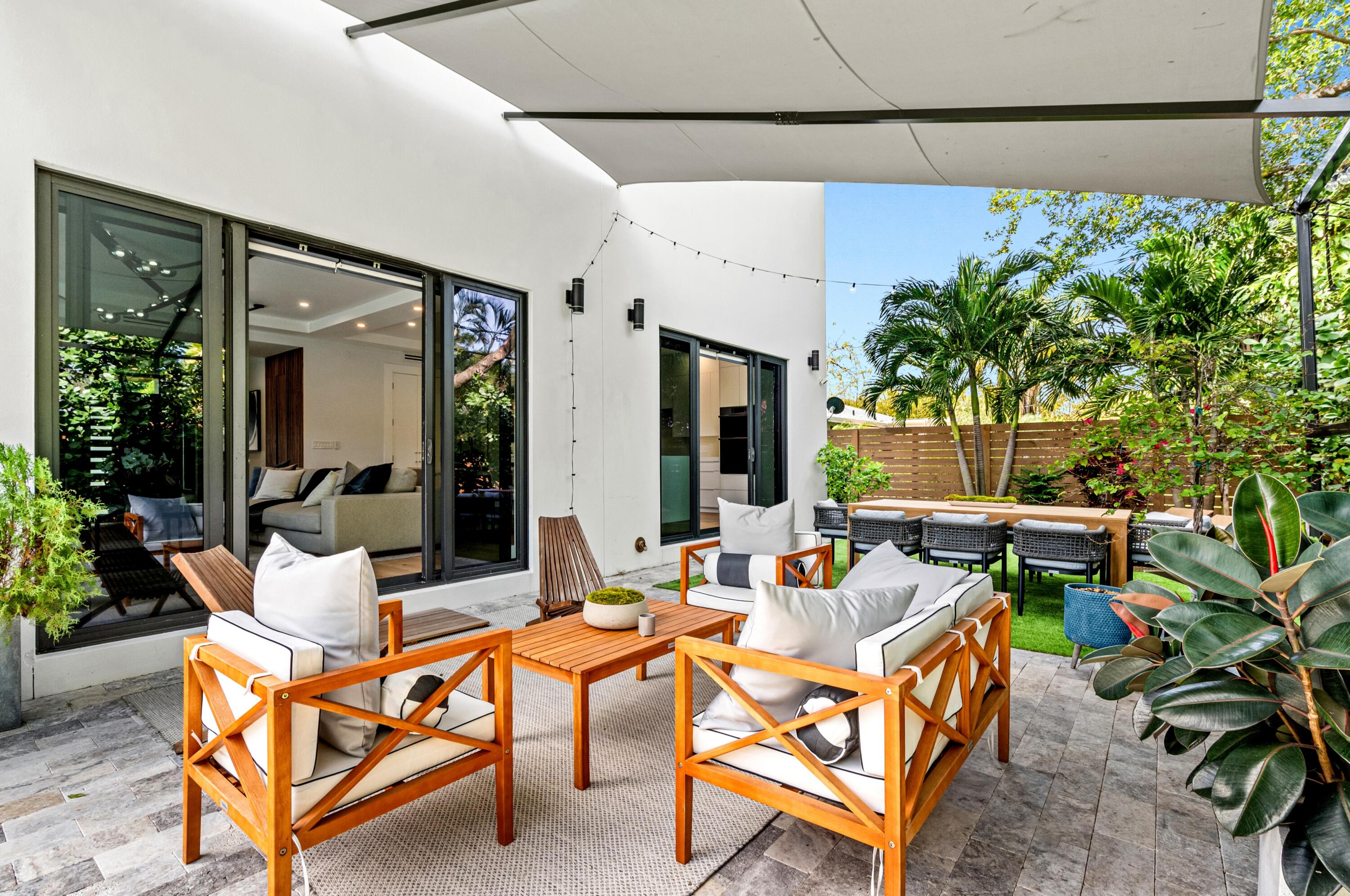 709 Northwest 6th Drive Boca Raton, FL 33486 - Photo 34 of 45 a outdoor space with the couches and a potted plant