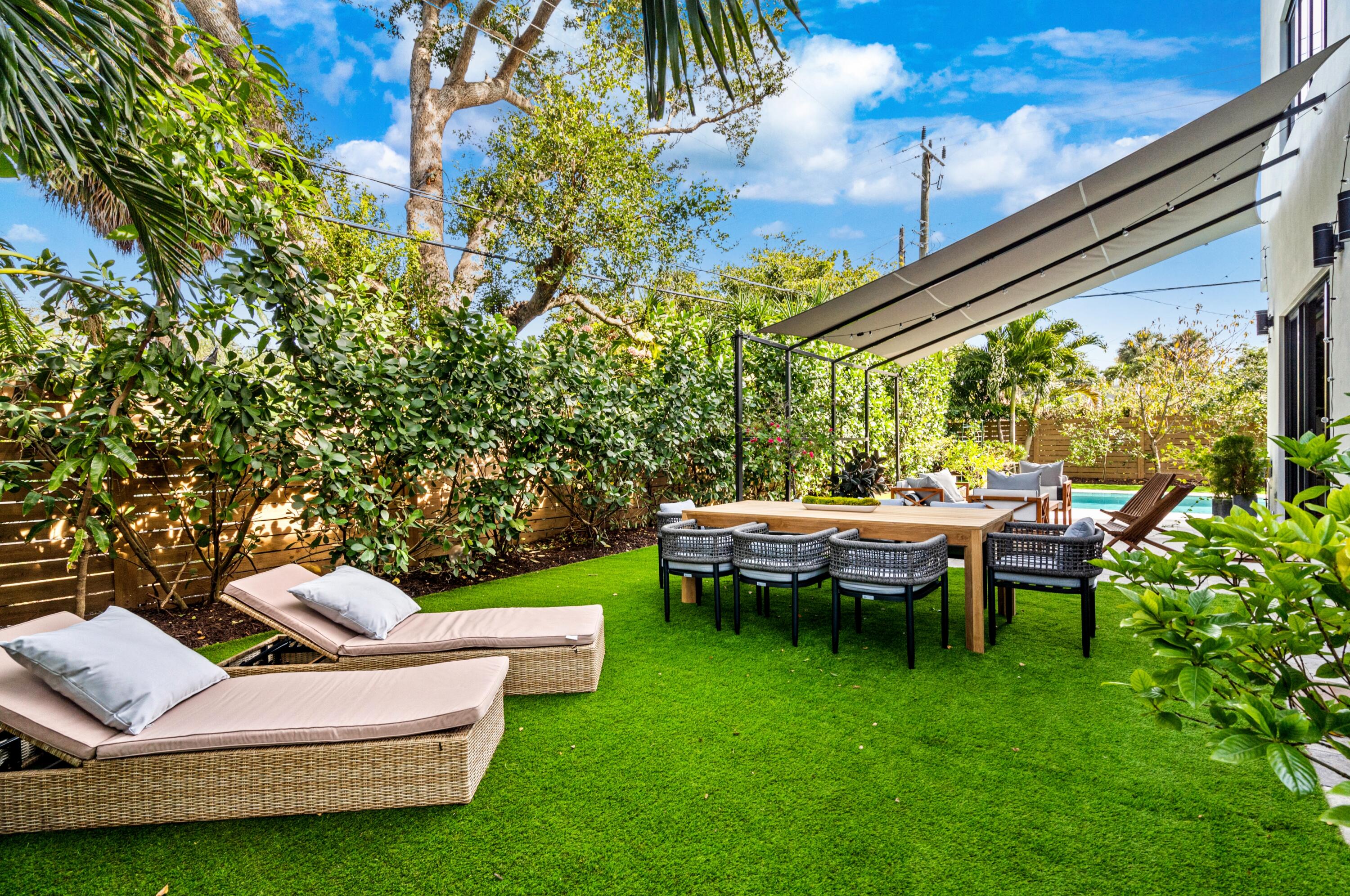 709 Northwest 6th Drive Boca Raton, FL 33486 - Photo 36 of 45 a view of a patio with chairs and plants