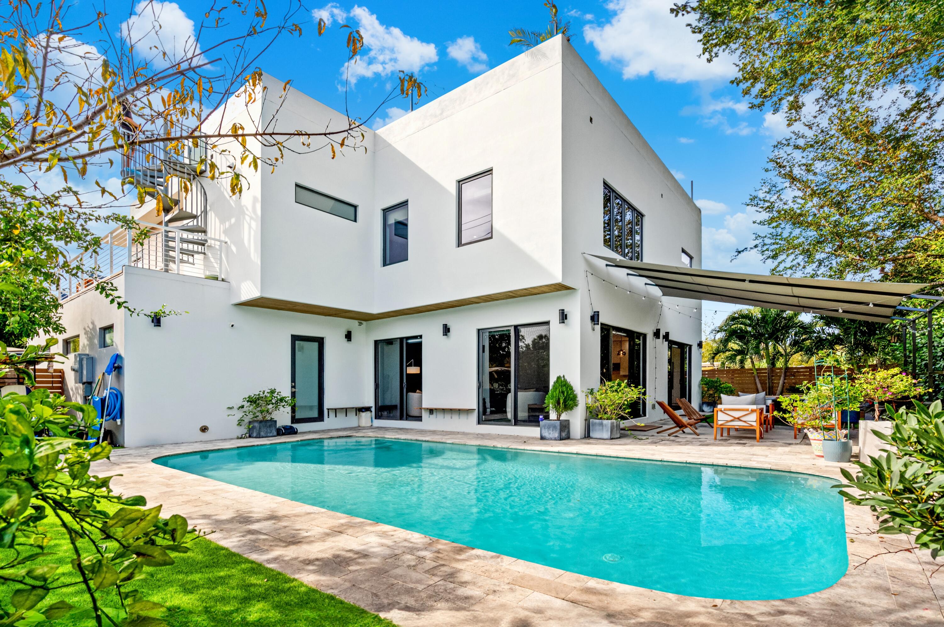 709 Northwest 6th Drive Boca Raton, FL 33486 - Photo 43 of 45 a view of a house with swimming pool