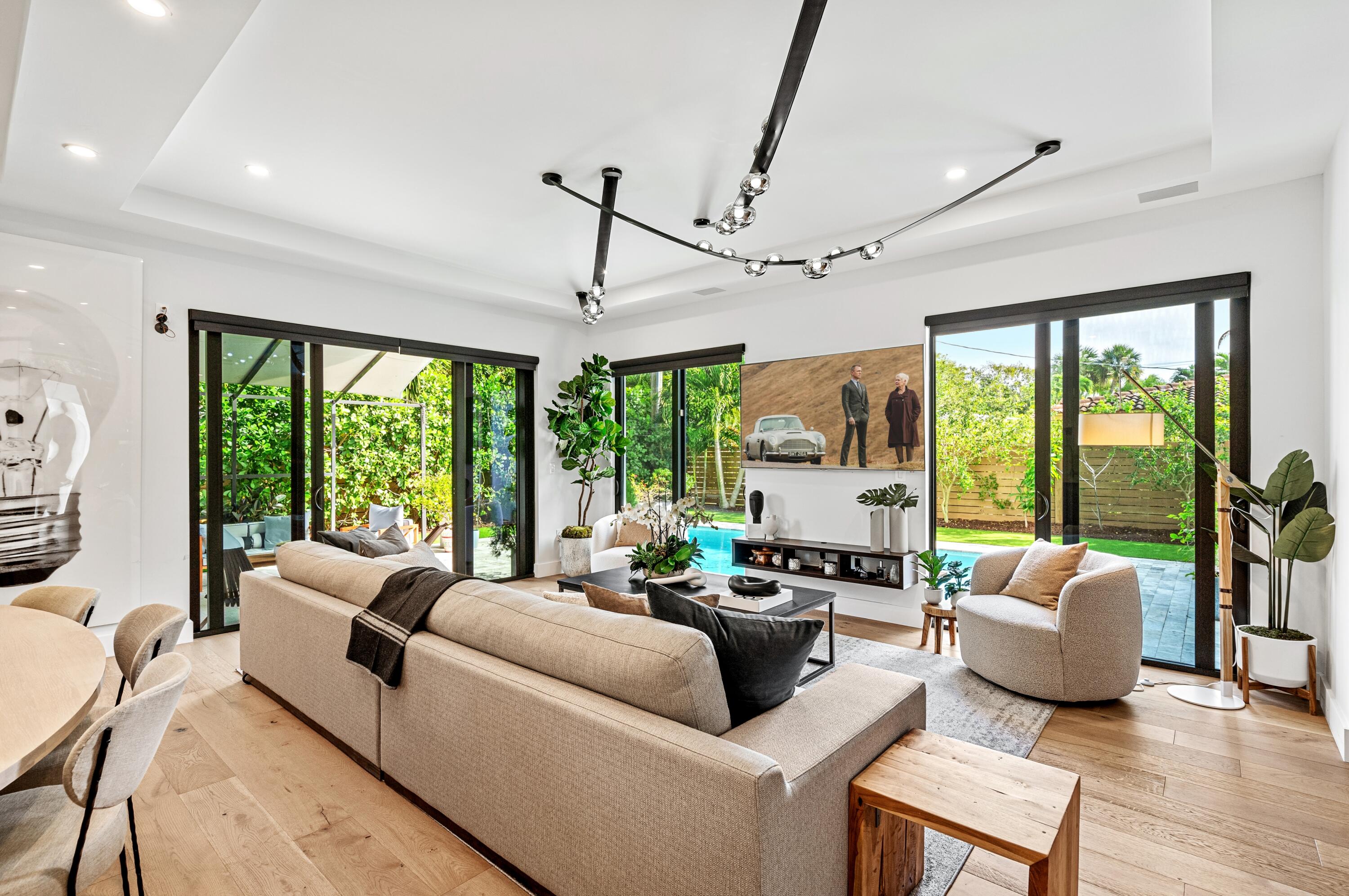 709 Northwest 6th Drive Boca Raton, FL 33486 - Photo 6 of 45 a living room with furniture and large windows