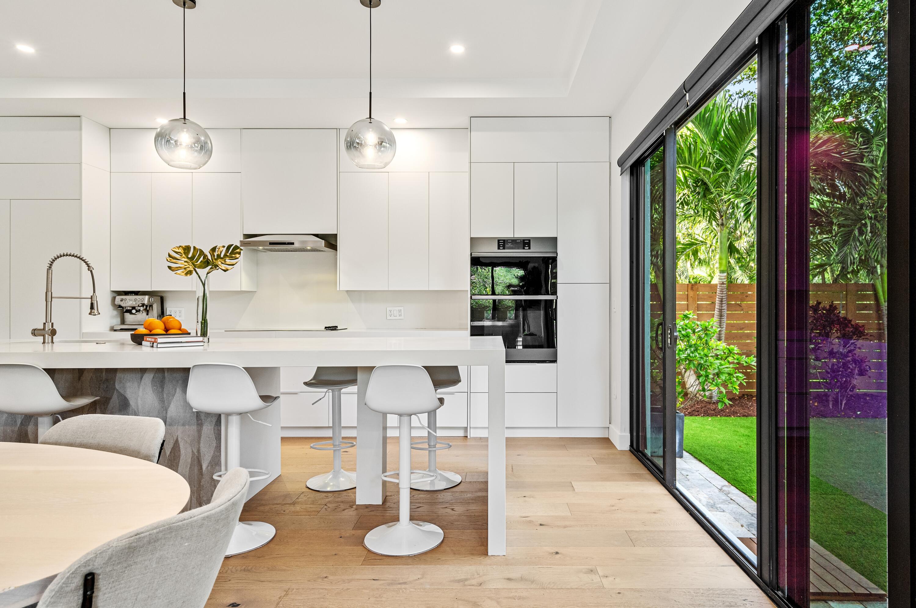 709 Northwest 6th Drive Boca Raton, FL 33486 - Photo 9 of 45 a view of a dining room with furniture window and outside view
