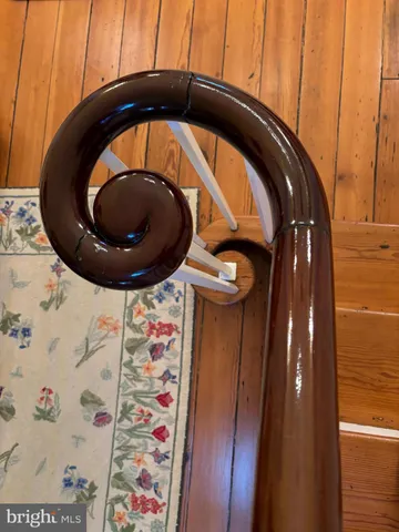 a kitchen with stainless steel appliances a stove a chimney a sink and a refrigerator