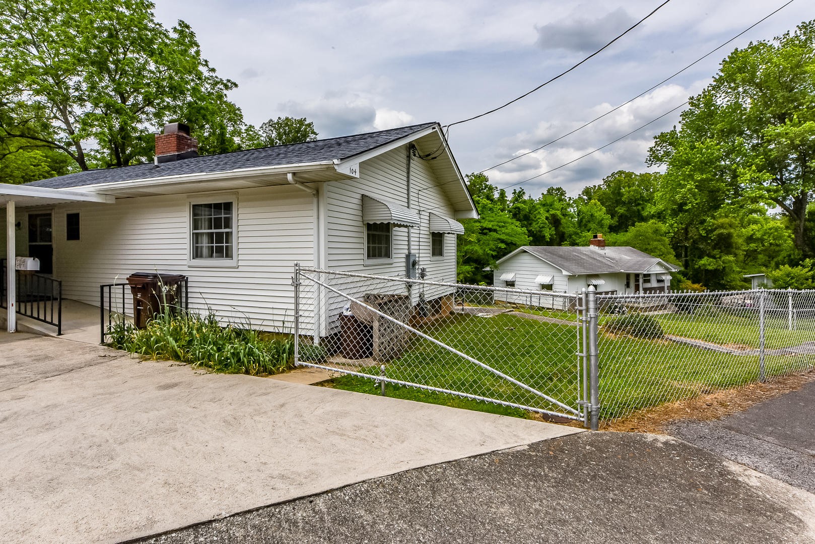 104 East Price Road Oak Ridge, TN 37830 - Photo 1 of 16 a house that has a yard