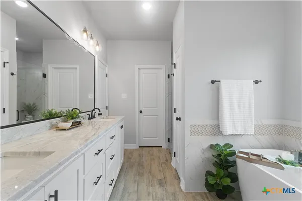 an empty room with a window and a ceiling fan