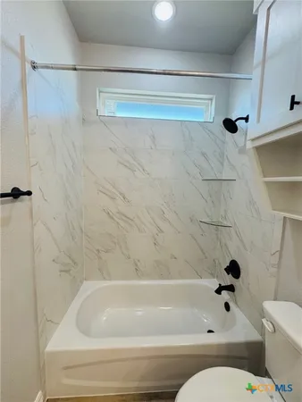 a aerial view of a house with swimming pool having outdoor seating