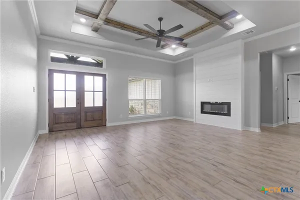 a kitchen with kitchen island granite countertop a sink appliances a counter space and a center island