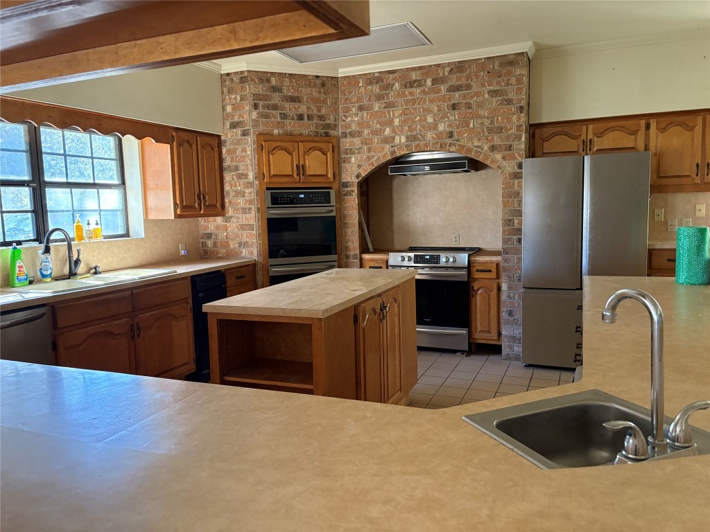 784 Highway 183 Highway Refugio, TX 78377 - Photo 10 of 20 a kitchen with stainless steel appliances granite countertop a sink a stove and a refrigerator