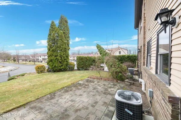 a view of a patio with table and chairs and potted plants