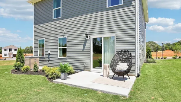 a view of backyard with a garden and entertaining space