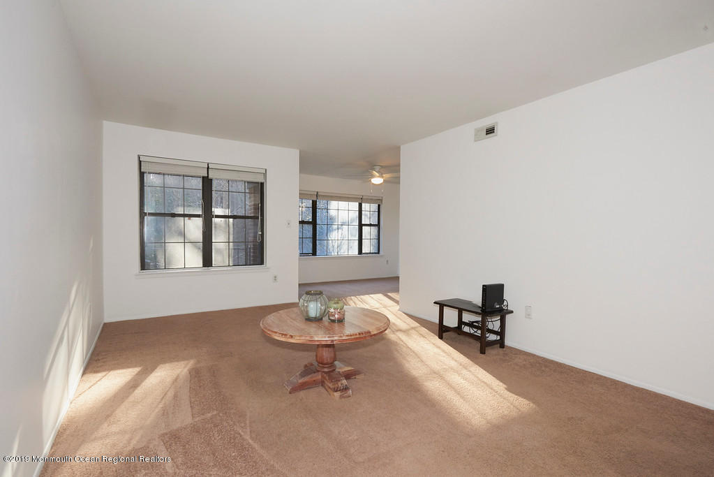 200 Portland Road, Unit E18 Highlands, NJ 07732 - Photo 3 of 16 a living room with furniture and window