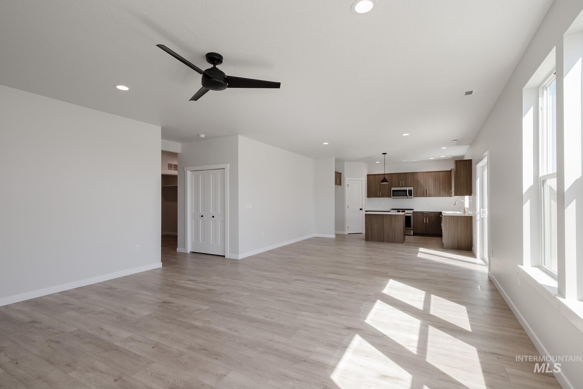 2231 South Border Way Meridian, ID 83642 - Photo 12 of 23 Unfurnished living room with recessed lighting, a ceiling fan, and light wood finished floors
