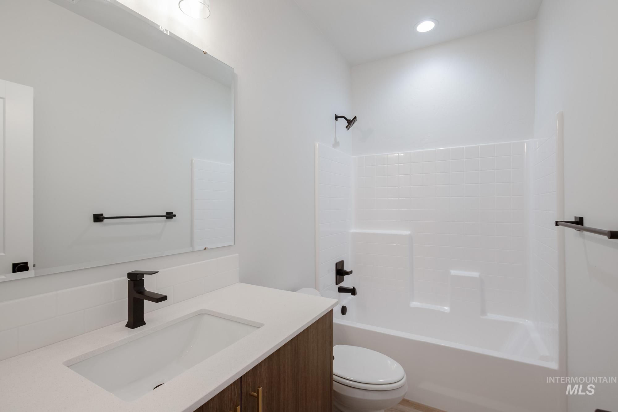 2231 South Border Way Meridian, ID 83642 - Photo 15 of 23 Full bathroom featuring vanity, bathing tub / shower combination, and recessed lighting