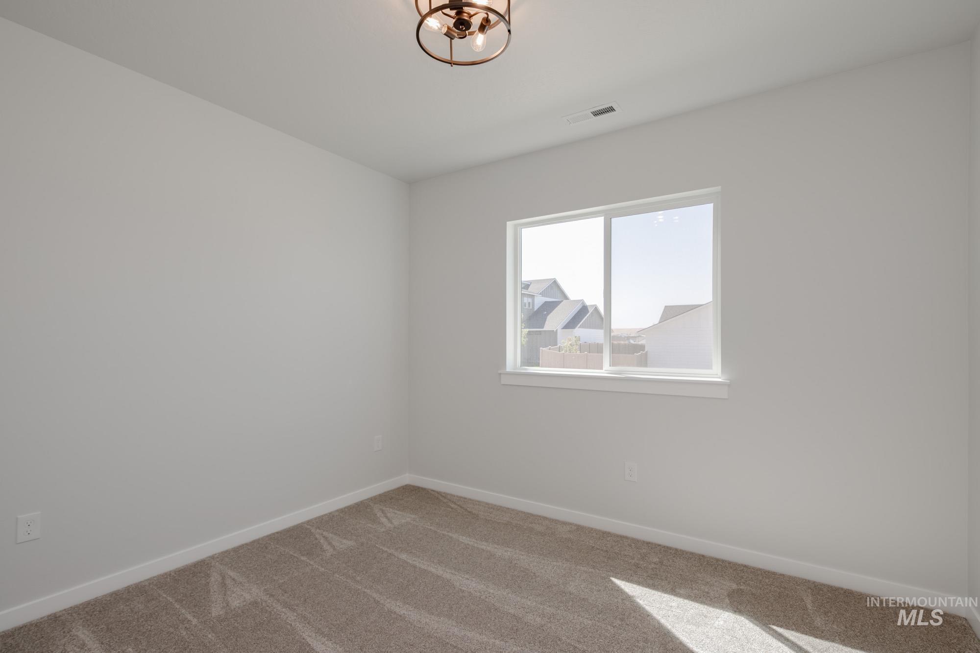2231 South Border Way Meridian, ID 83642 - Photo 23 of 23 Empty room featuring baseboards and carpet